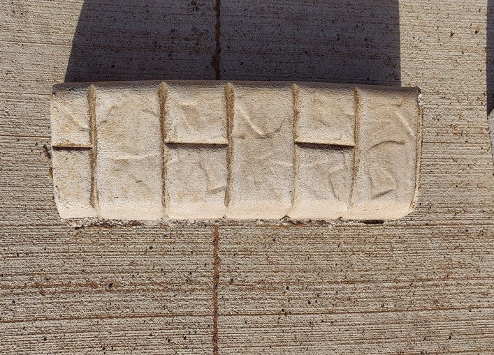 Slate roller texture along with the brick metal stamp on top of it. the curb is white and tan with a brick lookto it.