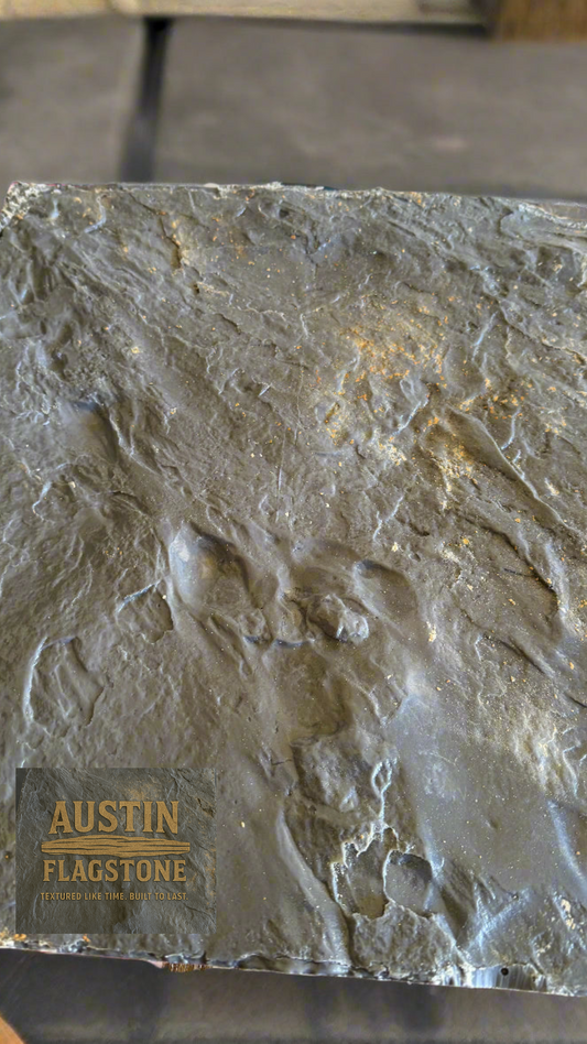 Flagstone with 'Austin Flagstone' branding on a blurred background
