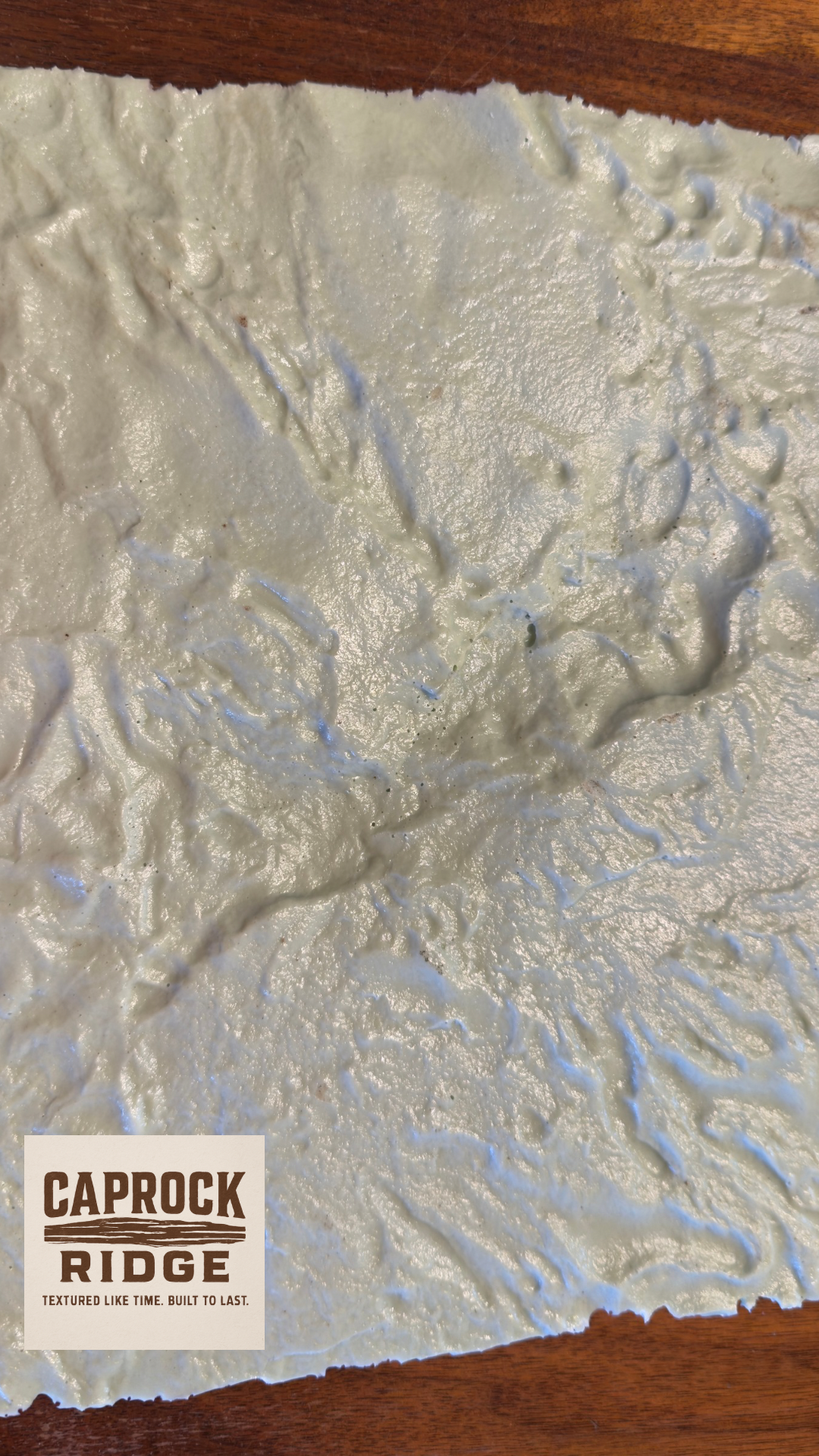 Textured wall finish sample with 'Caprock Ridge' branding