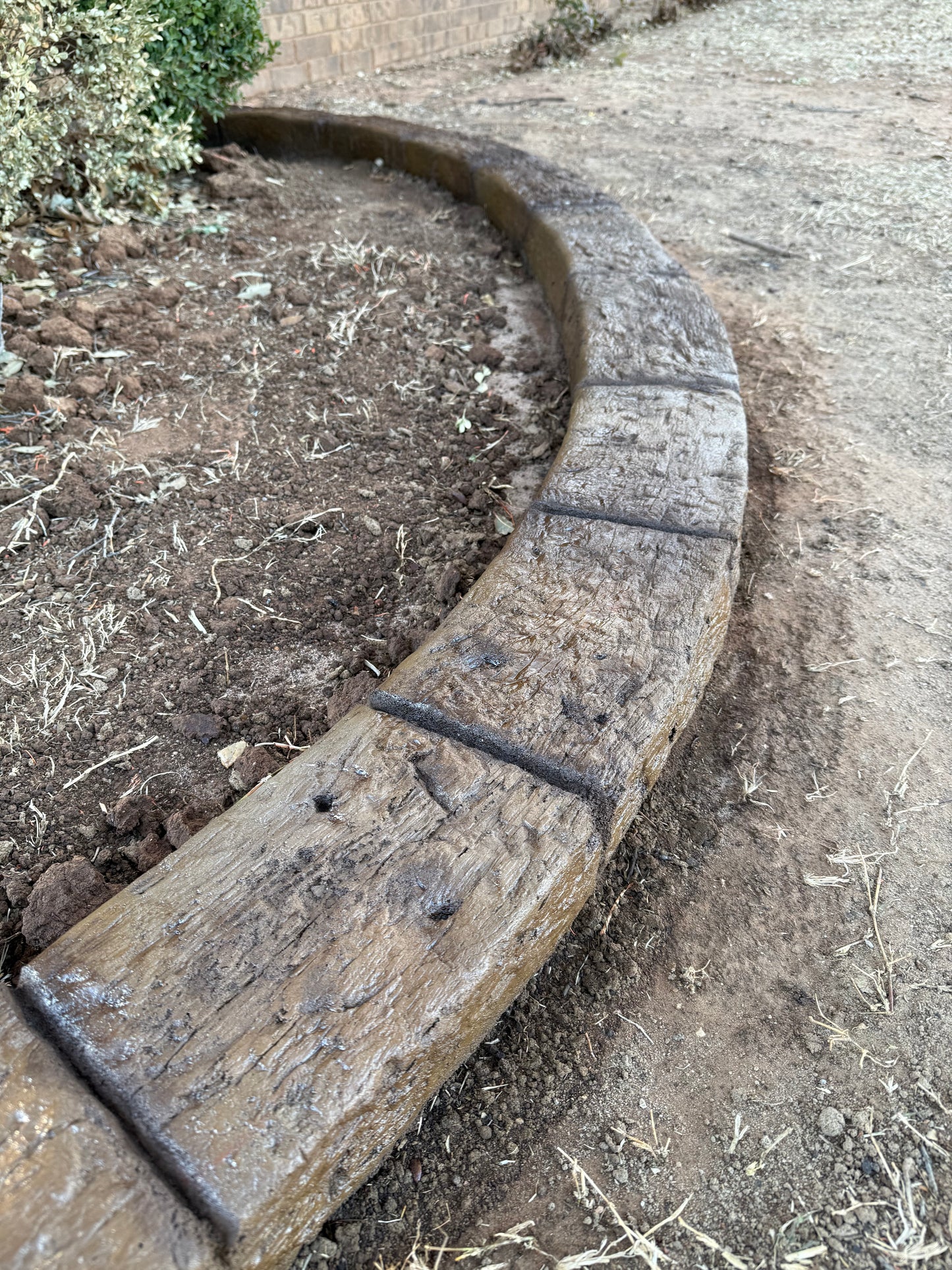 Timber Trail landscape curbing stamp on a landscape curb.