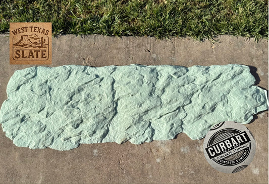 Green slate stone on a concrete surface with 'West Texas Slate' and 'Curbart' logos.