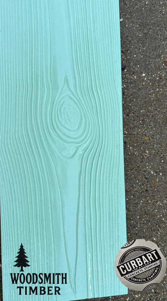Teal wood-textured concrete stamp with 'Woodsmith Timber' branding on a gray concrete background