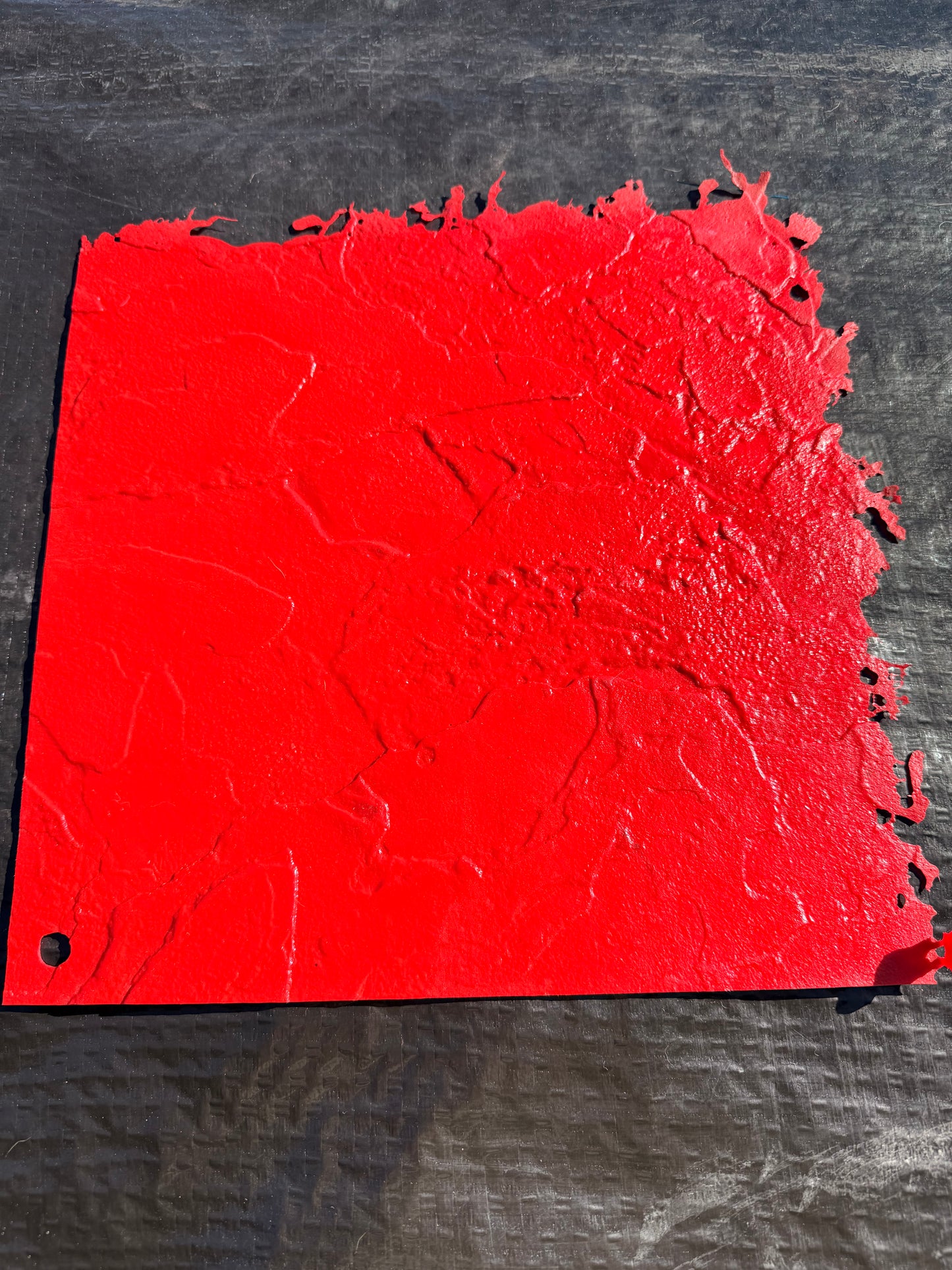 Red textured concrete mat  on a black background